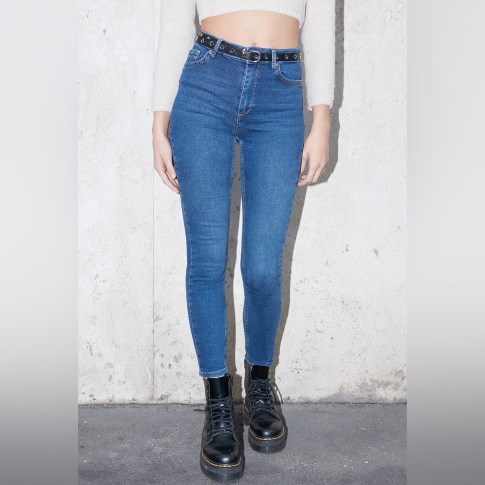Subdued high waisted blue denim skinny jeans